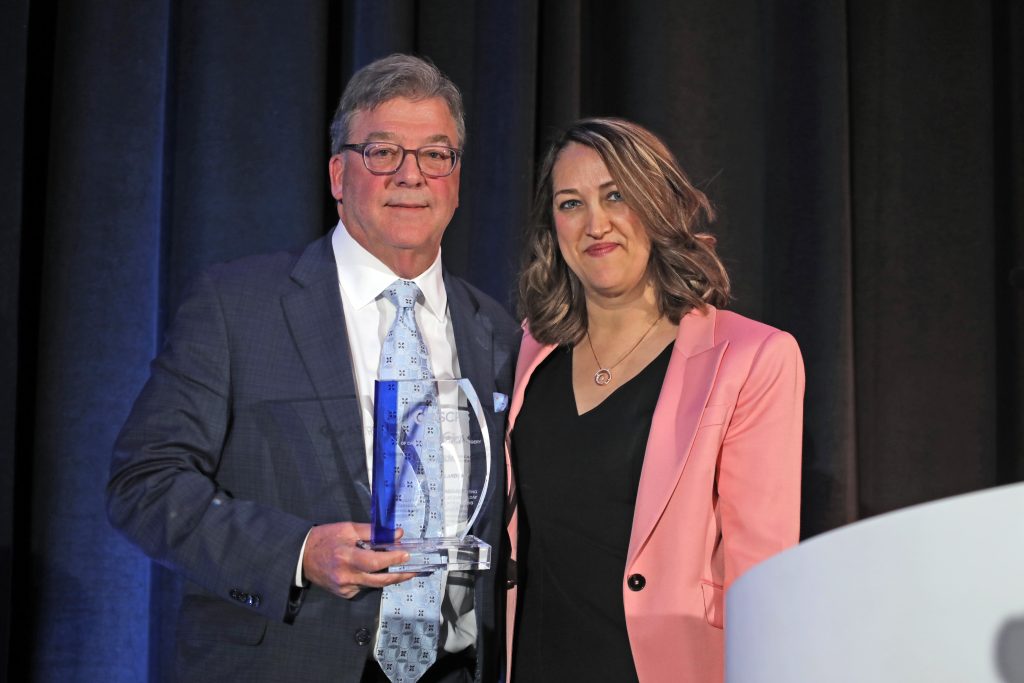 Dr. Holland receives the award for the inaugural Holland Lecture from Dr. Farid. 
Source: ASCRS 